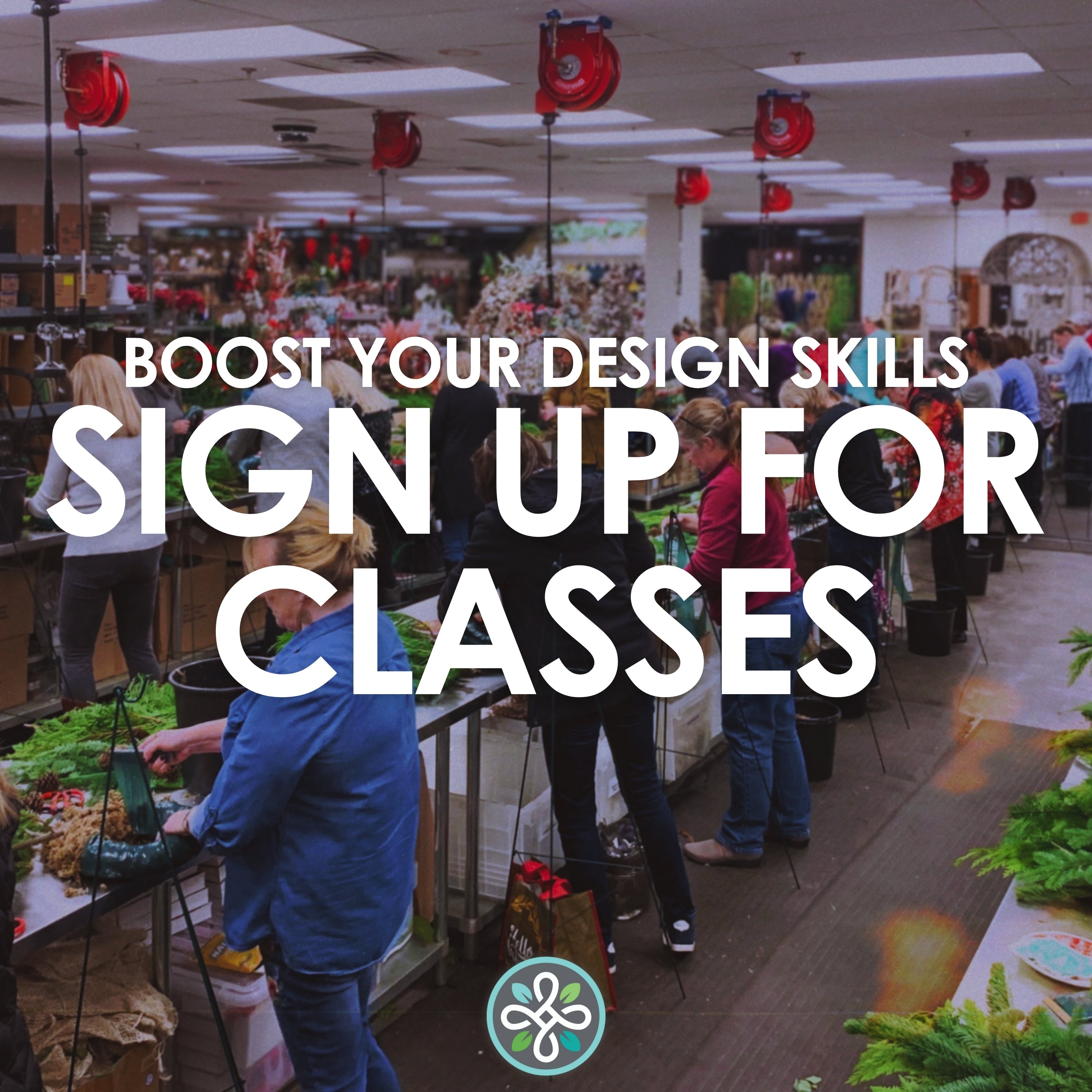 Rows of people standing at tables creating Christmas wreaths while attending a Metro Flower Market class.