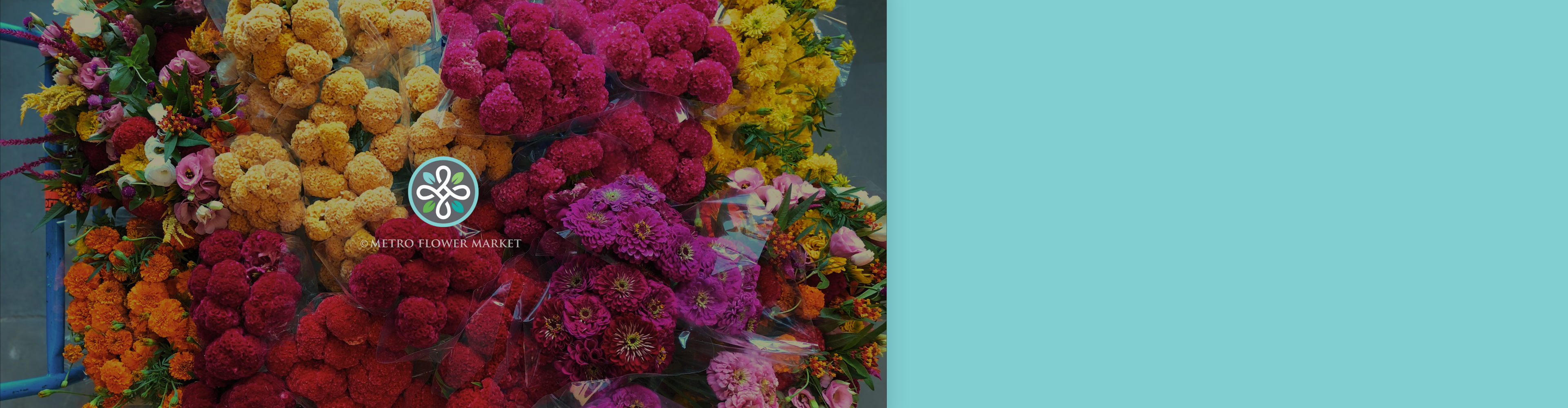 A flatbed cart full of bunched summer flowers in every color against a light teal background.