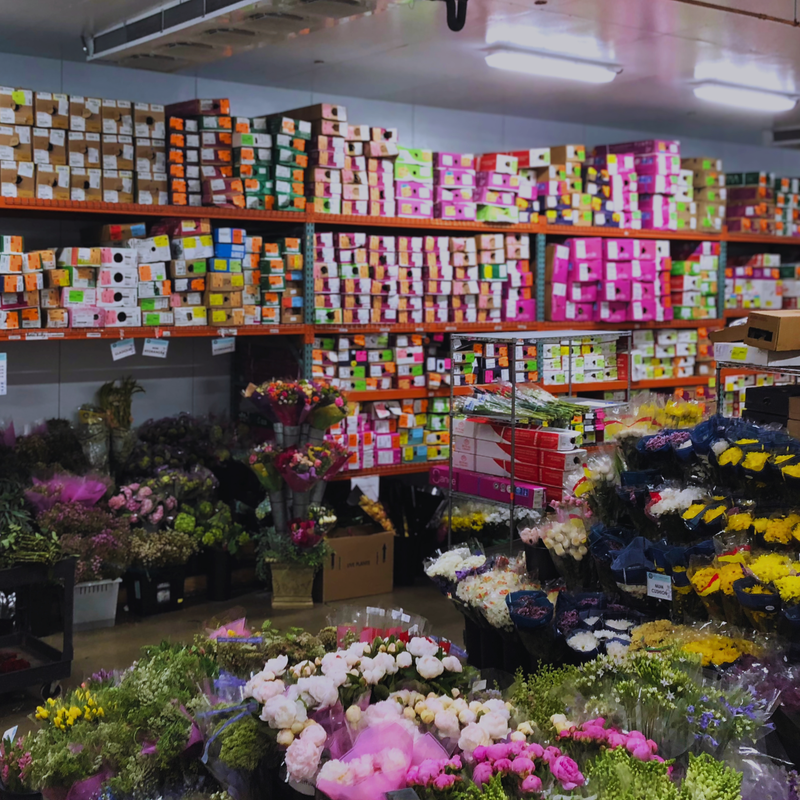 The walk-in cooler at Metro Flower Market stocked with fresh-cut flowers