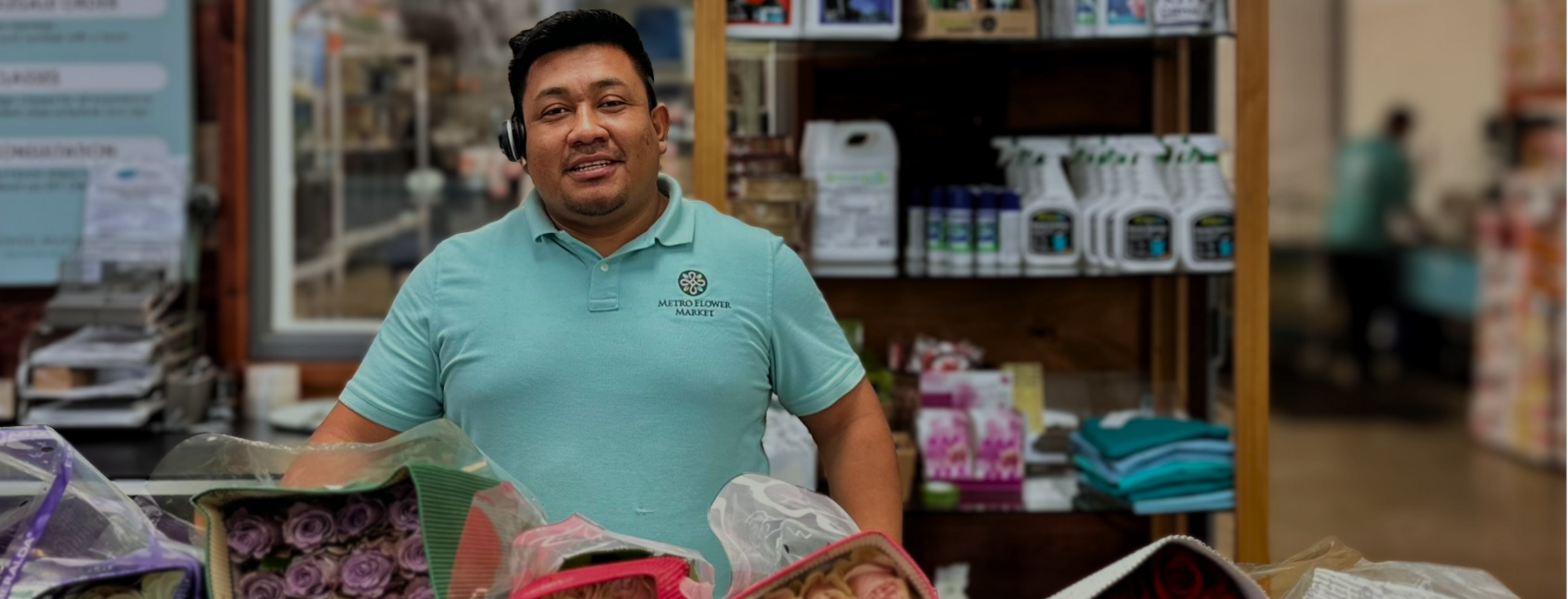 Henry is waiting to check you out at the front counter inside Metro Flower Market!